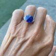 Adriatic Sea Sugarloaf Cabachon Blue Sapphire and 2 Cadillac Diamond Side Stones For Sale