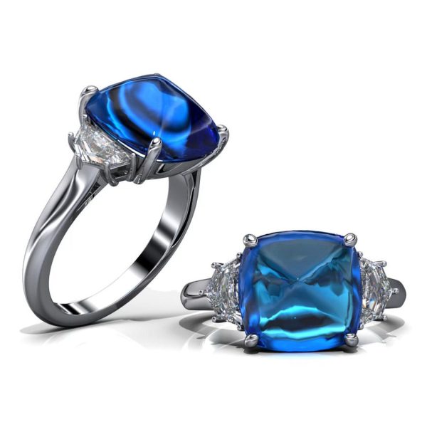 Adriatic Sea Sugarloaf Cabachon Blue Sapphire and 2 Cadillac Diamond Side Stones For Sale